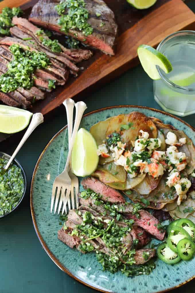 Tomatillo Chimichurri Flank Steak with Spiked Herb Butter Lobster Potatoes