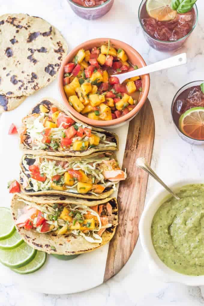 Grilled Salmon Tacos with Chipotle Mango Salsa and Tomatillo Avocado Slaw - These are completely Paleo with one ingredient paleo taco tortillas!